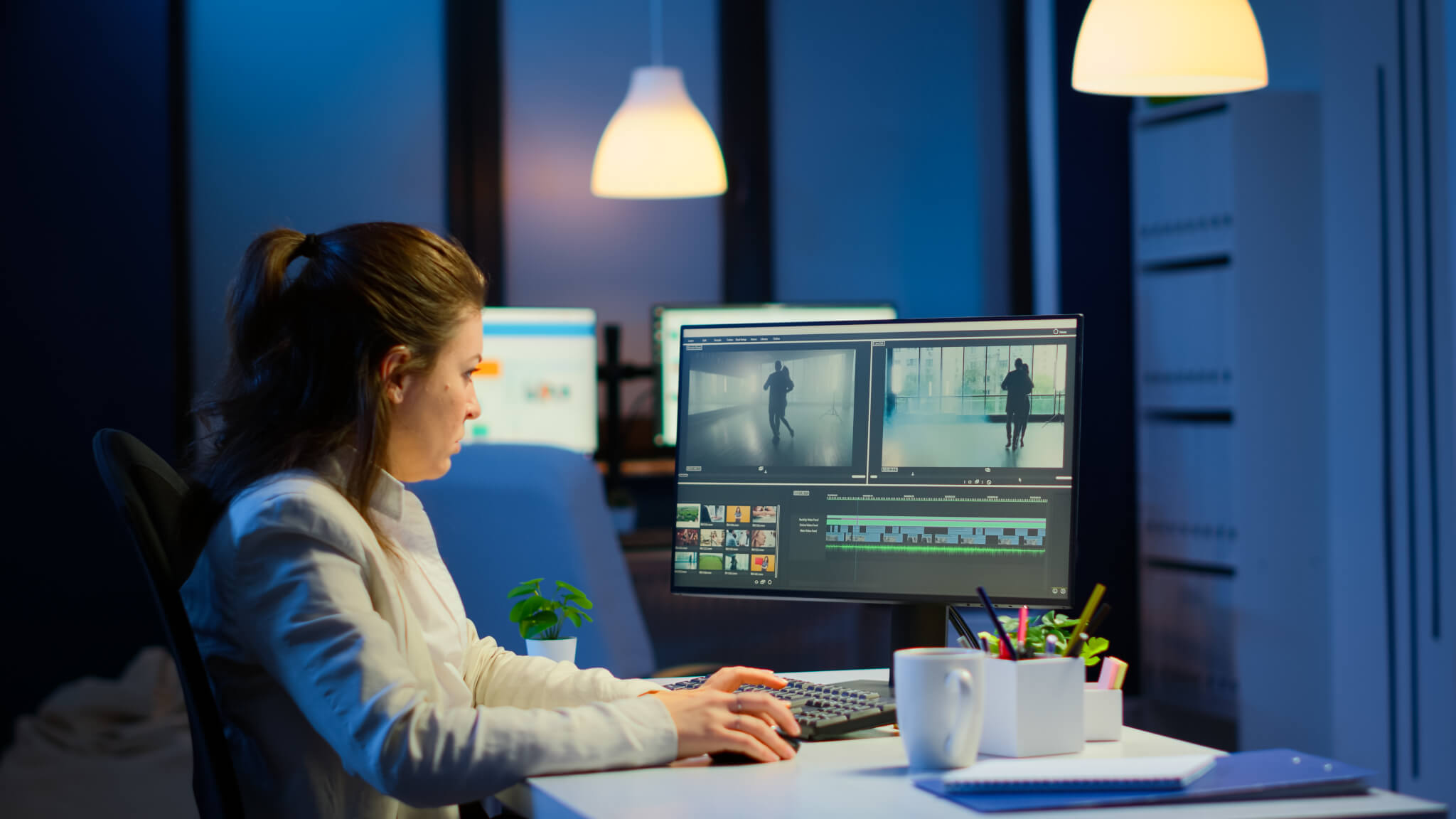 videographer-overworking-at-computer-from-business-office.jpg